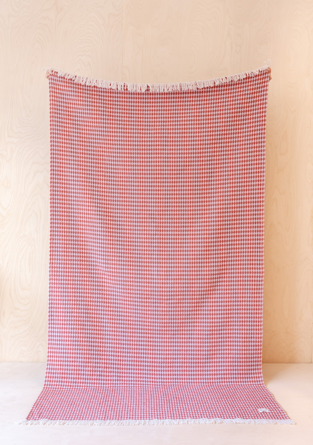 Baumwollüberwurf in rosa Argyle-Muster